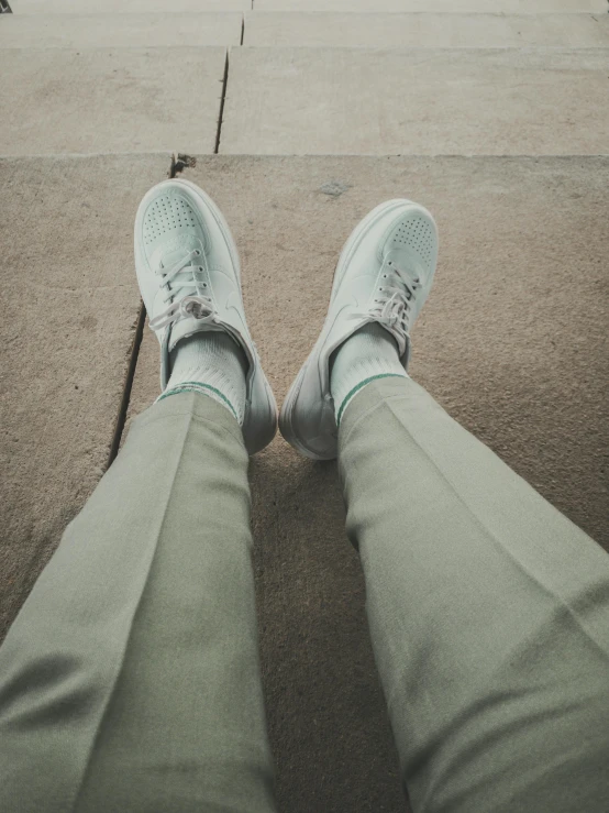 the shoes have been placed on the sidewalk for someone to sit down