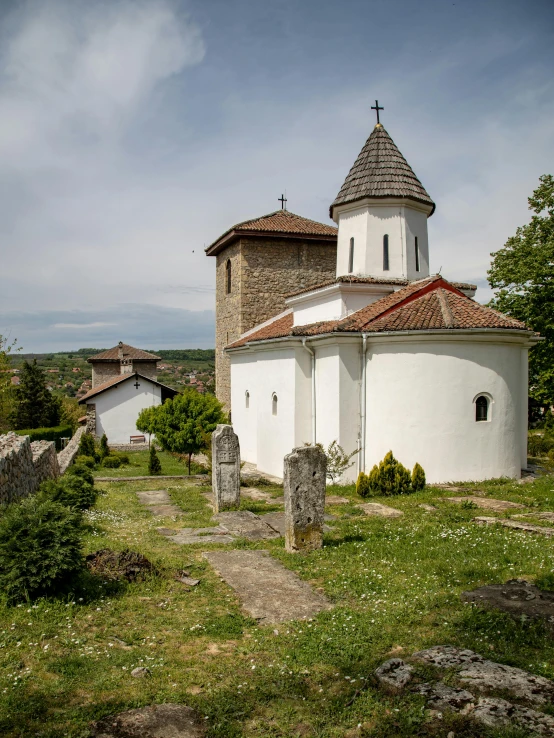 the small chapel in front of an old cemetery