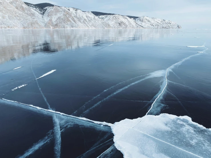 there are two lines in the ice with no snow on them