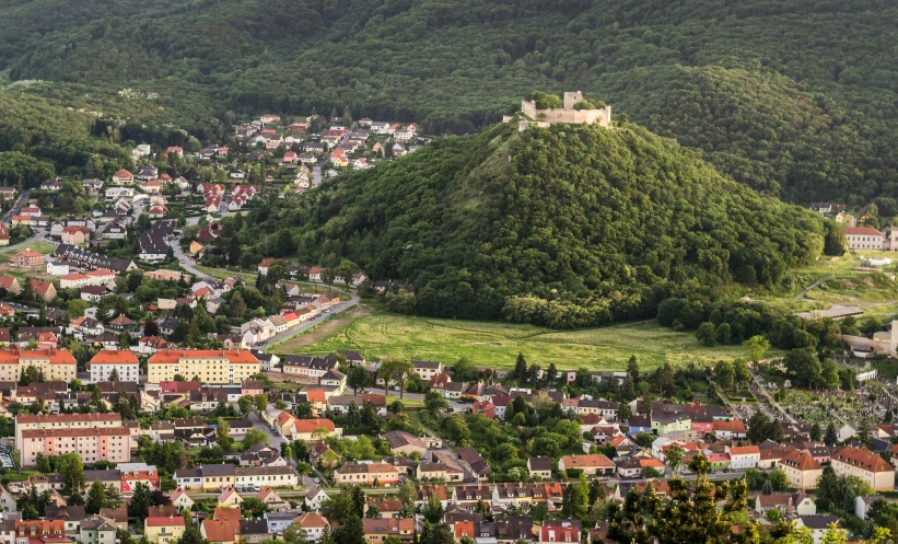 a beautiful town surrounded by lush green hills