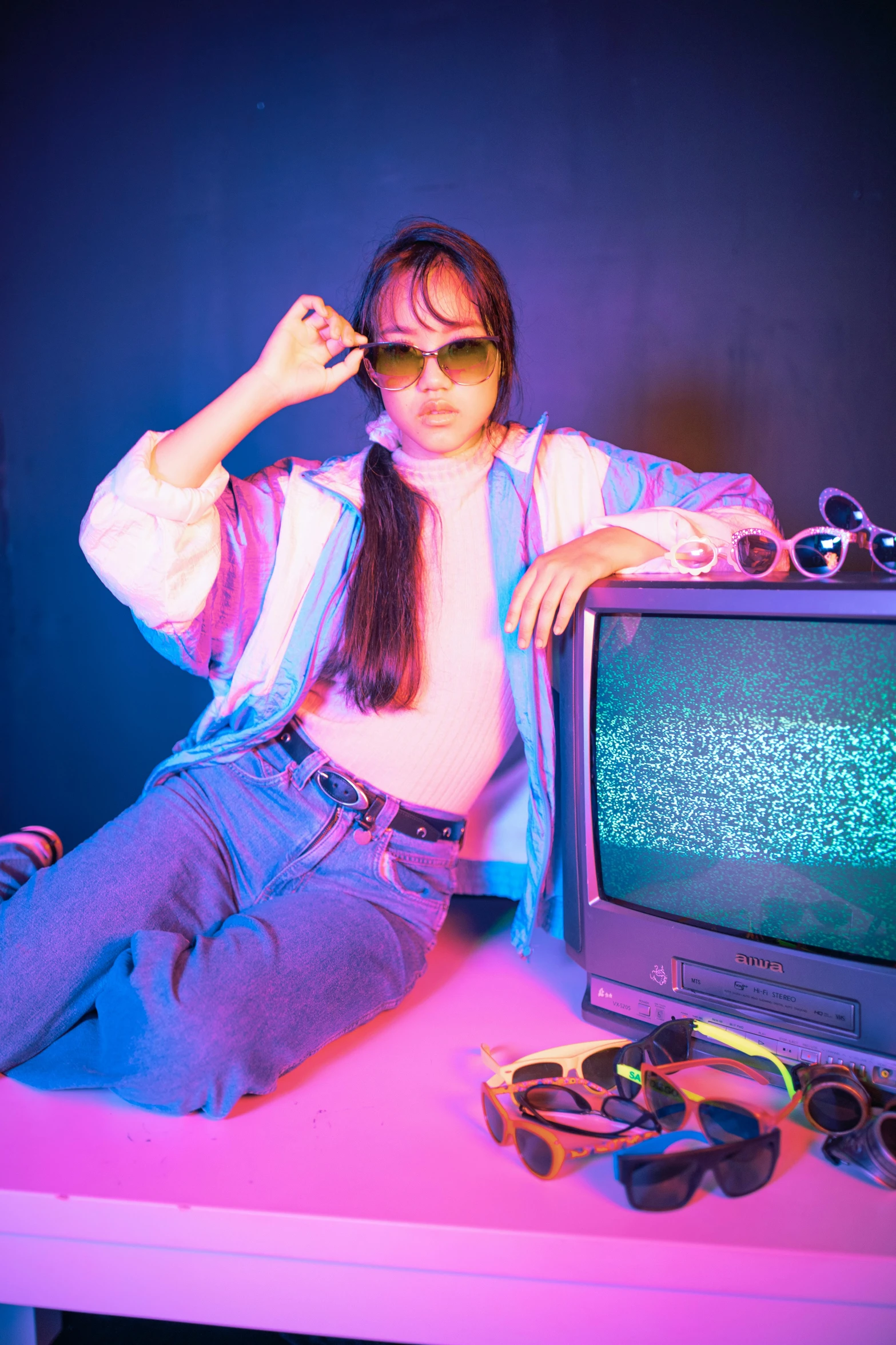 a person is sitting in front of an old television