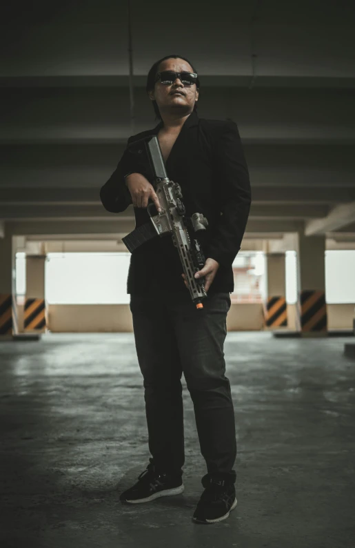 a man standing in an empty parking garage