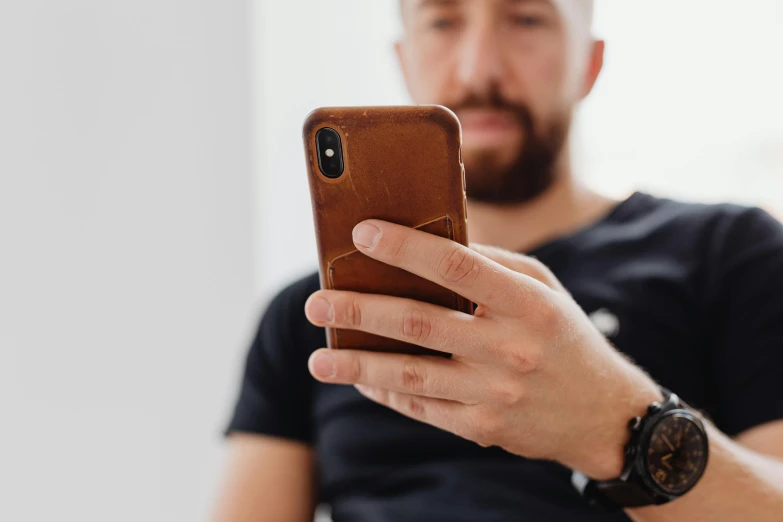 a man taking a pograph with his iphone