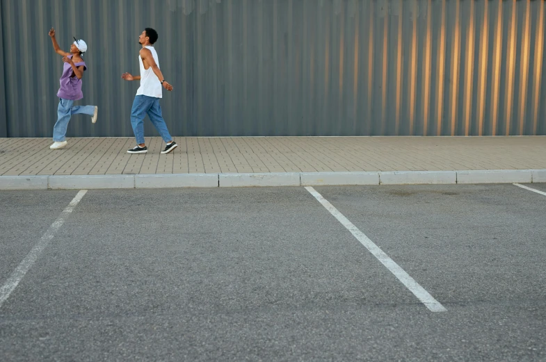 two young children are in the parking lot