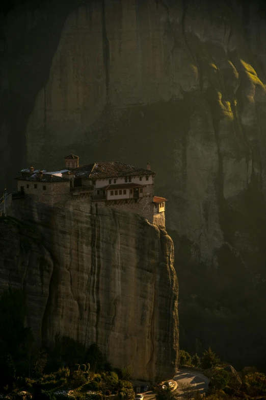 the rock formation with a castle sitting on top