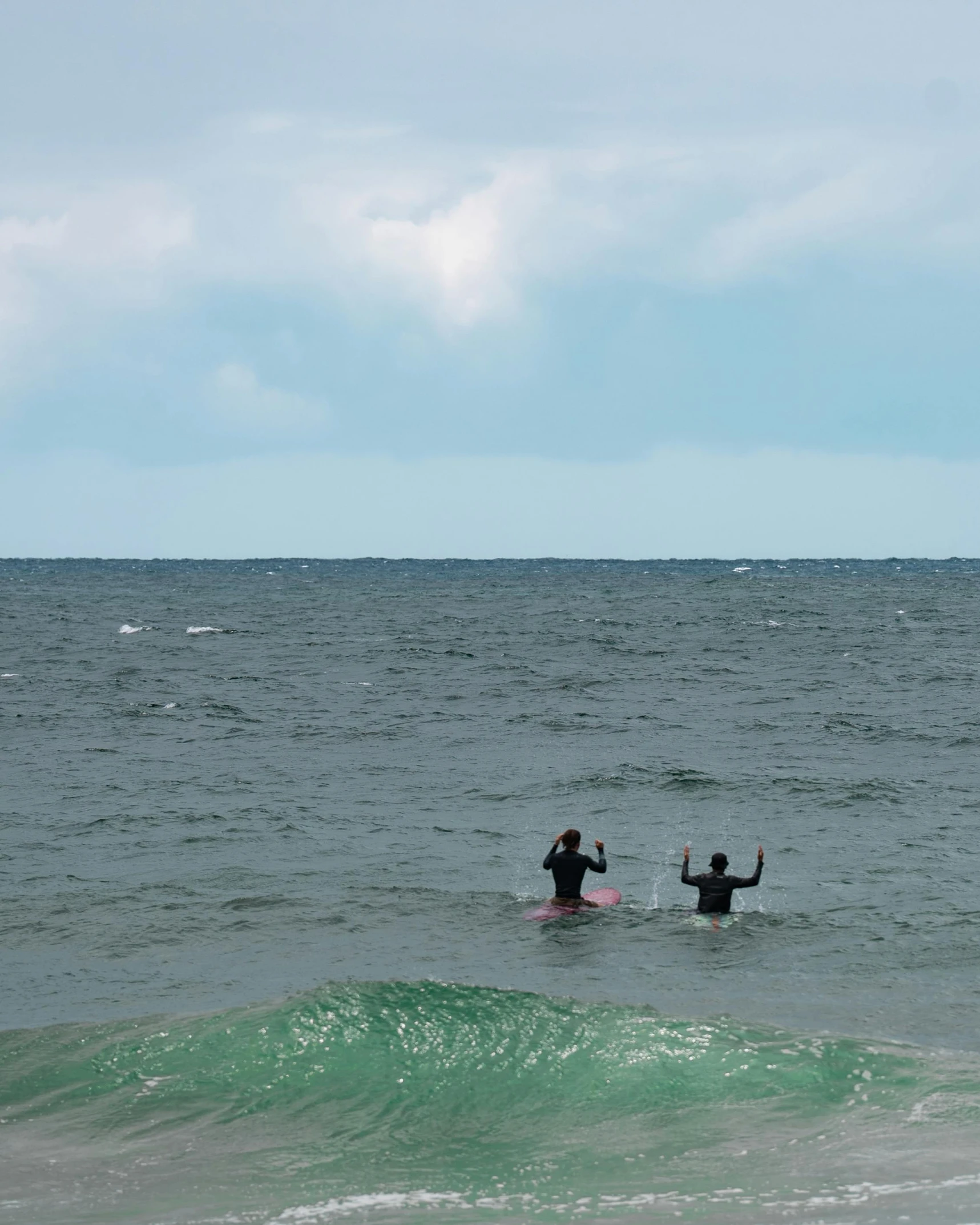 people with surfboards are on the ocean