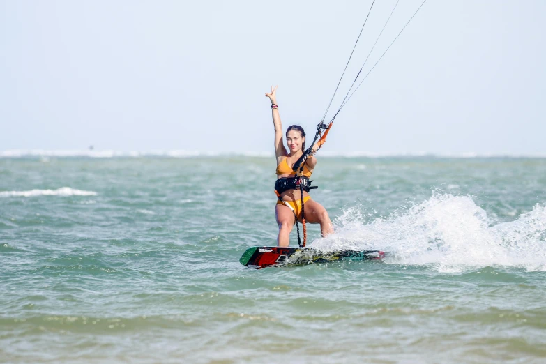 a person in the water with a parasailer