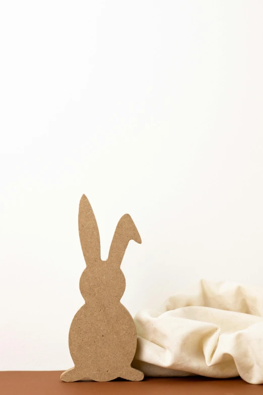 there is a cardboard bunny with its nose hanging