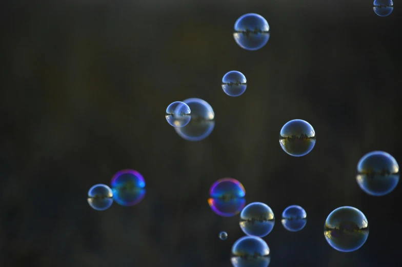 a couple of soap bubbles floating in the air