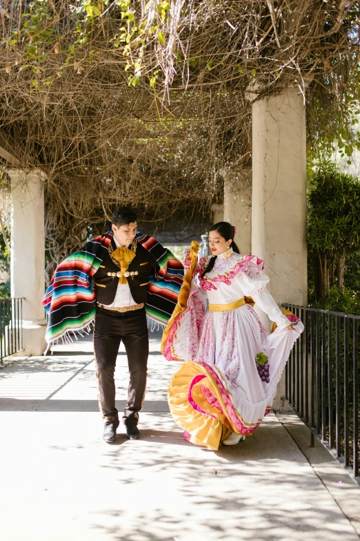 the two young people are dressed up in native costumes