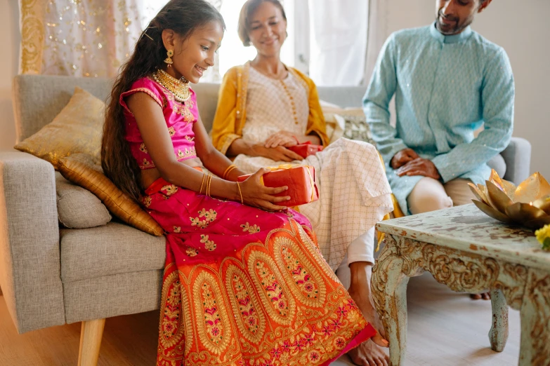 a man is standing by a lady in an indian outfit