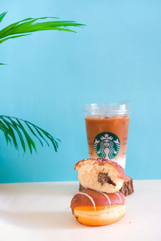 an iced coffee and pastry on a table