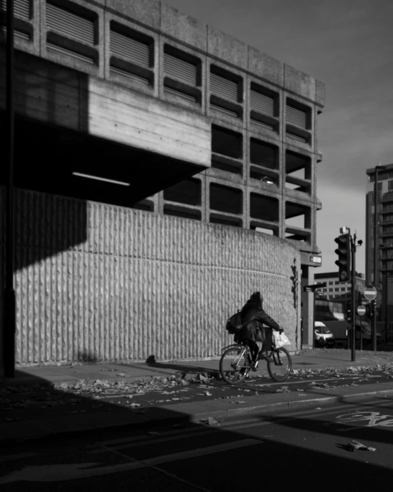 a person riding on a bike down a street