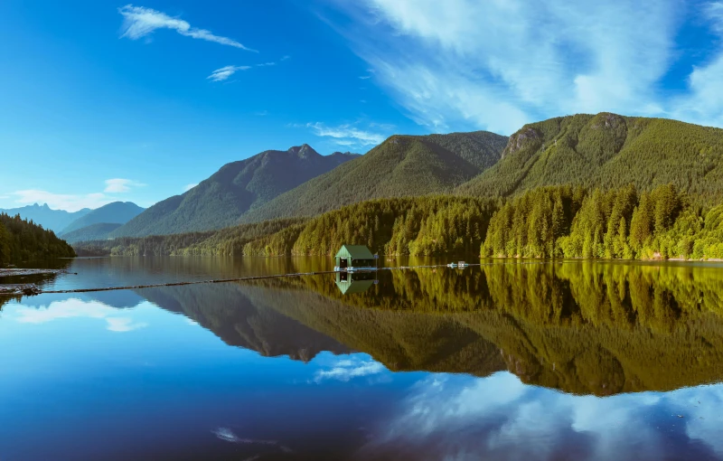 a lake with a mountain range in the background