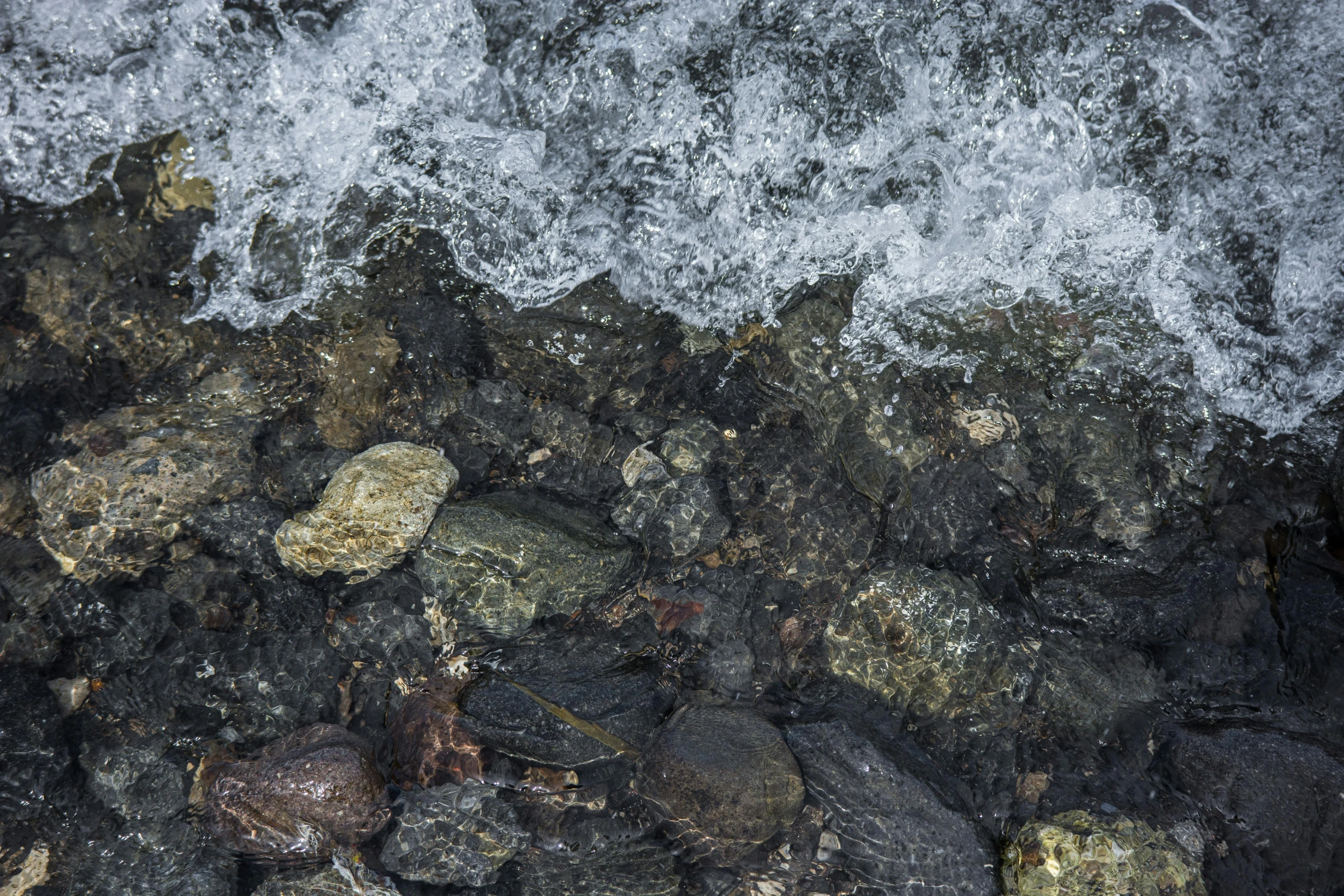 a very close view of rocks and water