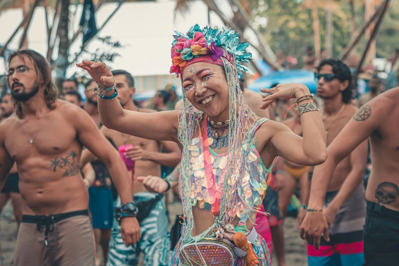 a young woman dancing at an outdoor festival