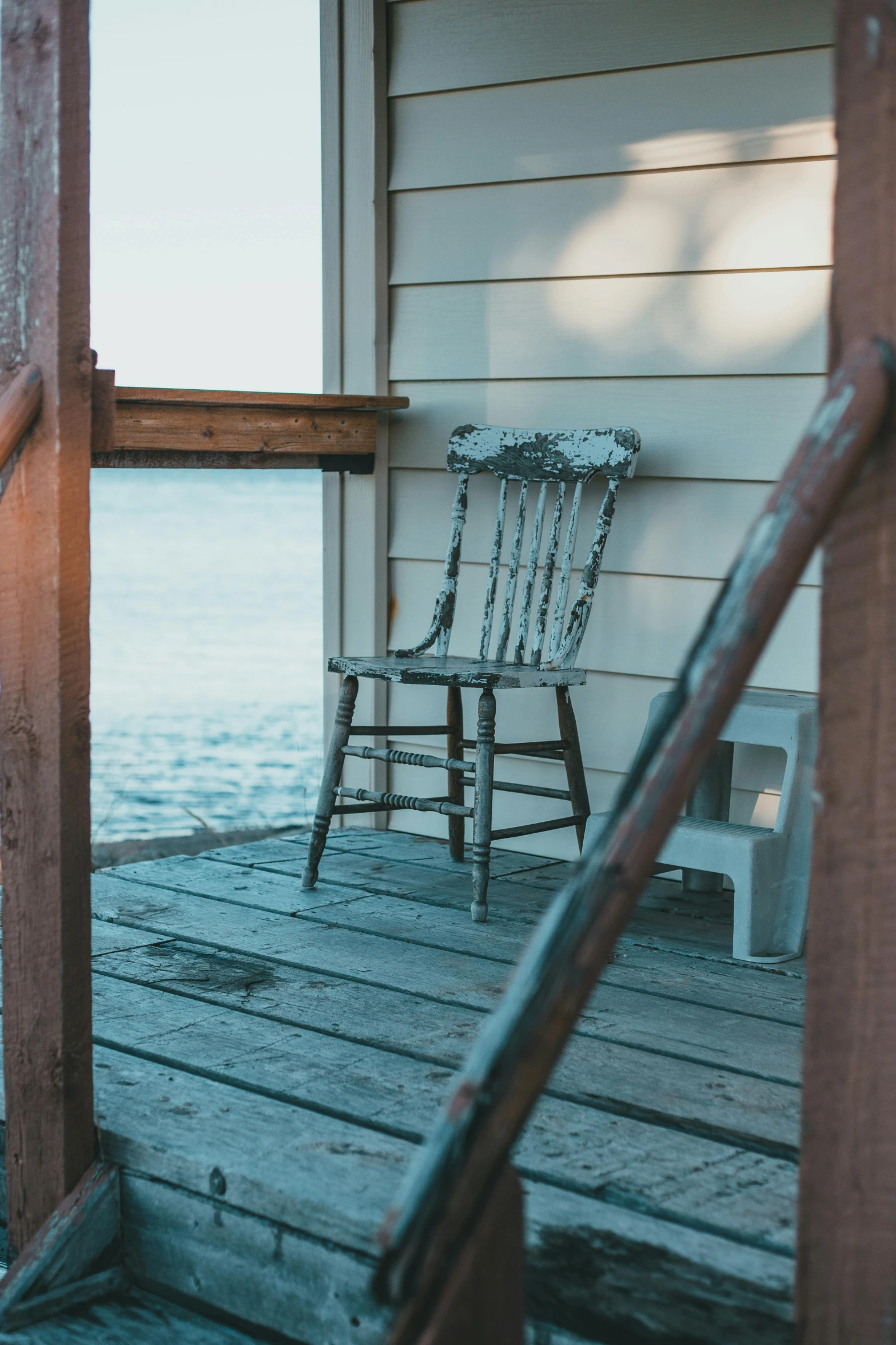 a chair and a chair sitting on a porch