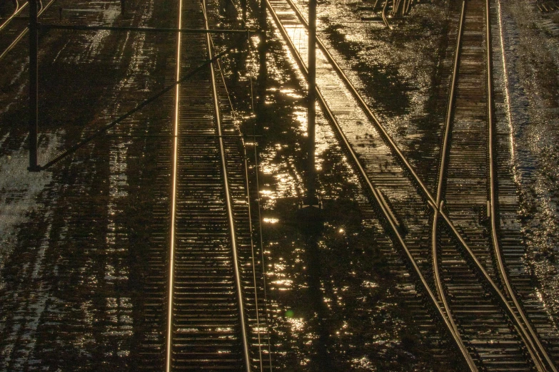a train track and train lights and sky