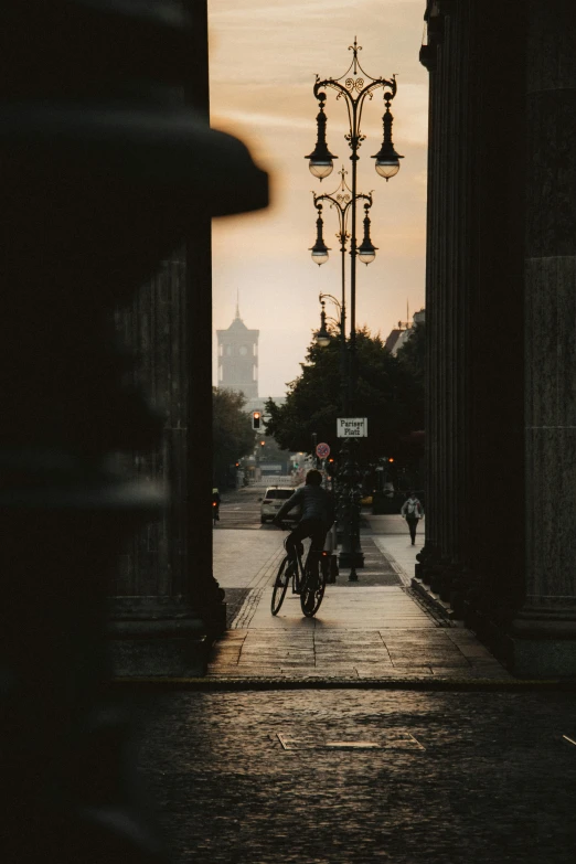 a man on a bike riding in an alley