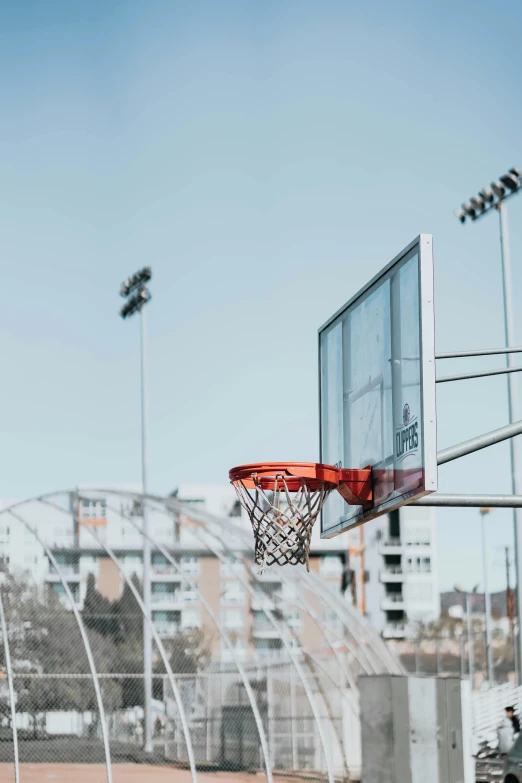 a basketball hoop with the basketball coming in the air