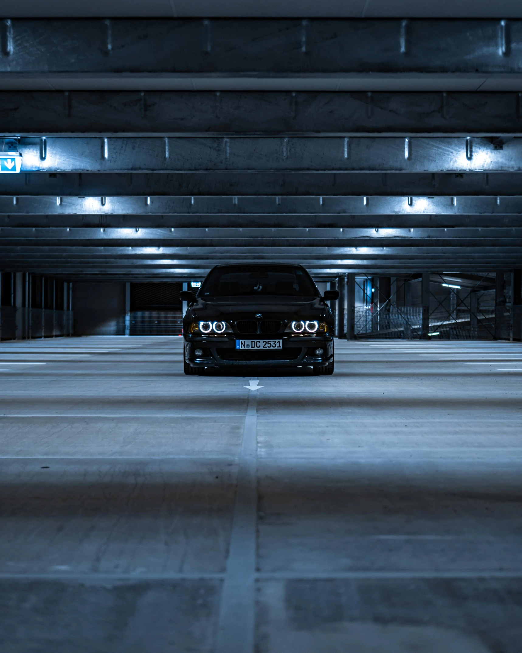 an open parking garage with an extended roof