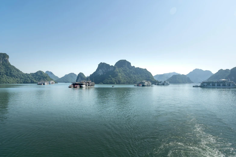 some boats floating in the water together