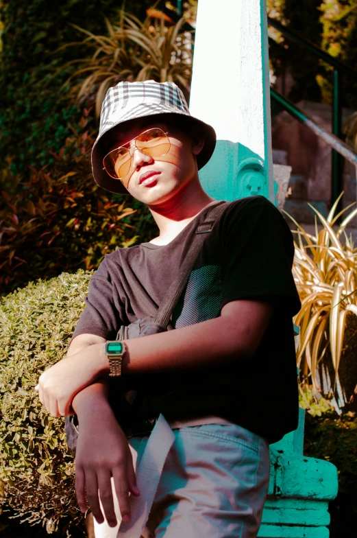 a boy poses for the camera with his arms crossed