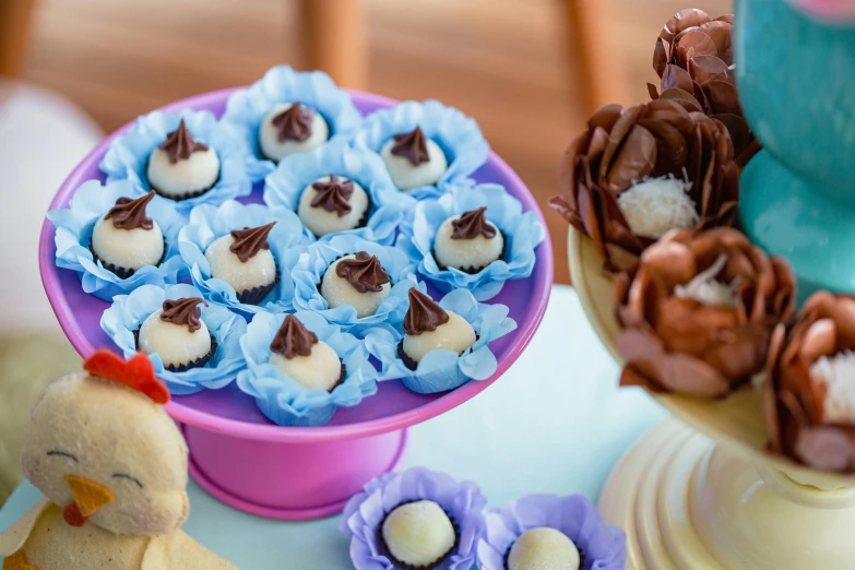 several cupcakes are sitting in small trays