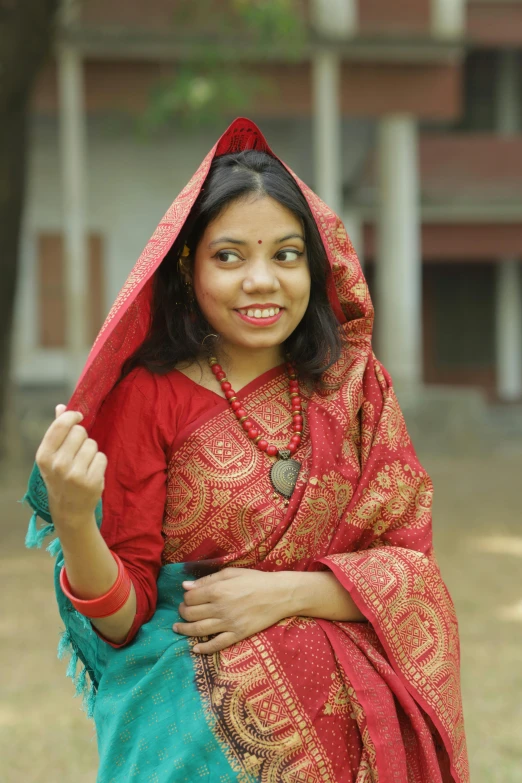 a young indian woman dressed in traditional indian garb