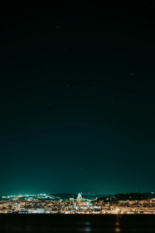 night time cityscape with stars in the sky