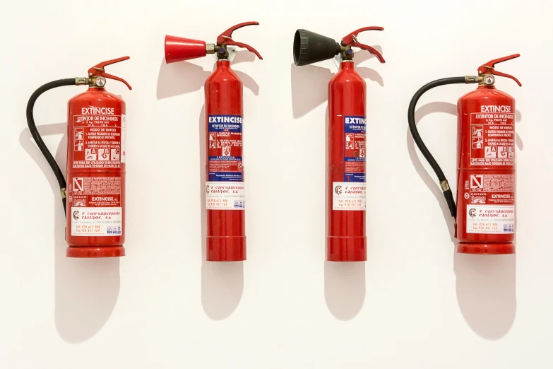 three different types of fire extinguistors lined up on top of each other