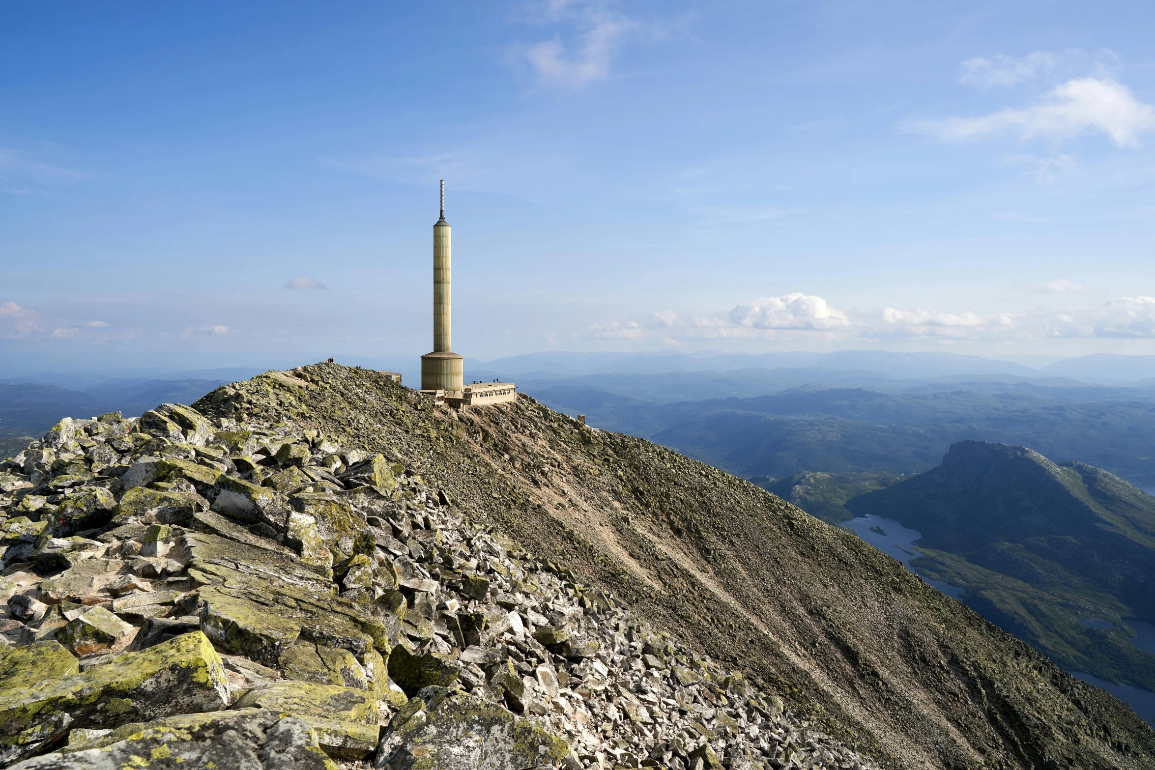 the mountain top is littered with stones and rocks