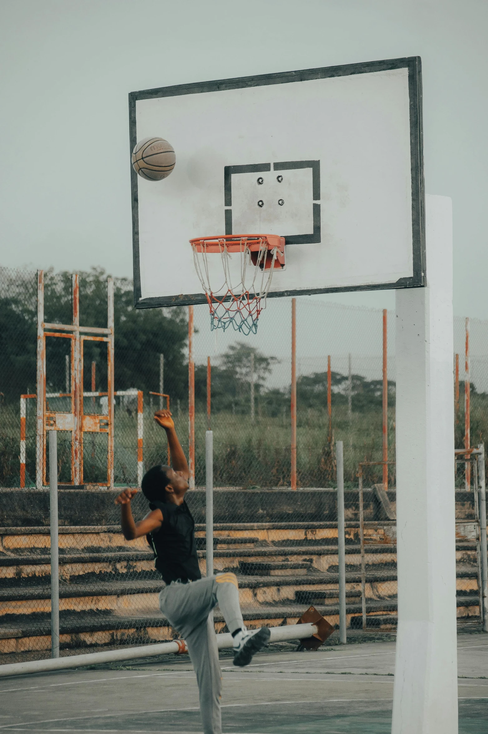 the man is jumping up to get a ball