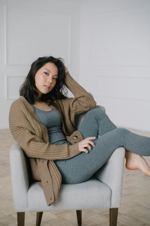 an image of a woman sitting in a chair