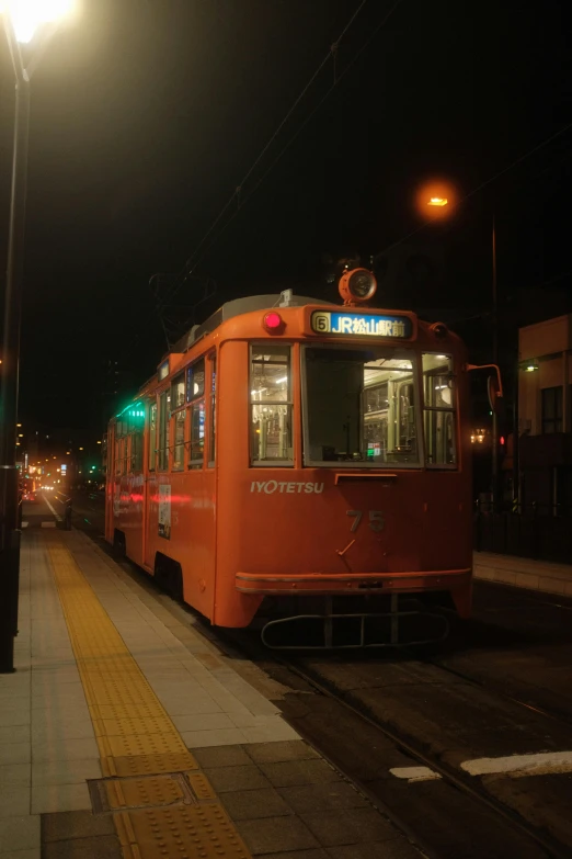 the trolley is waiting for the passengers at the station