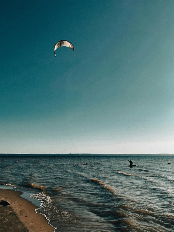 a person on the beach in front of the ocean