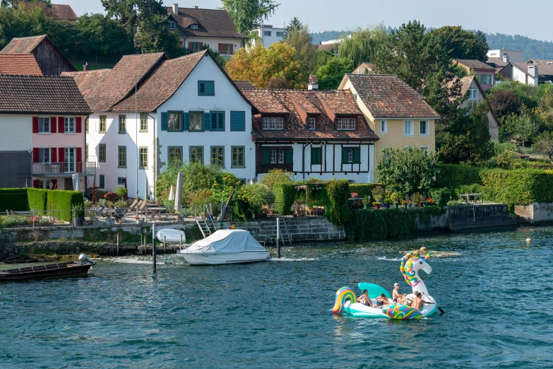 some people and a child are on some small boats