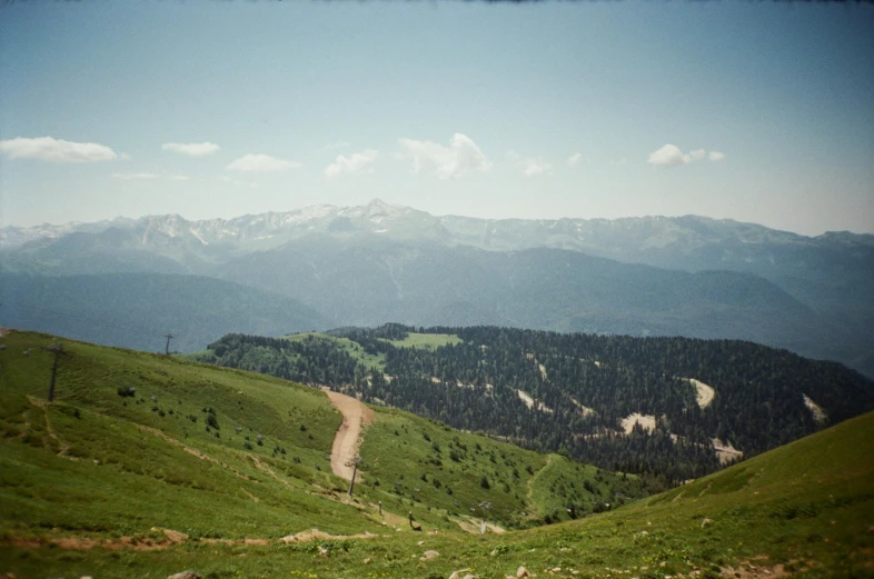 a scenic view of a mountain range during the day