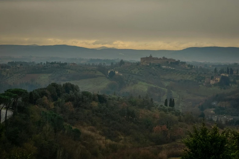 a landscape with a castle is seen in the distance