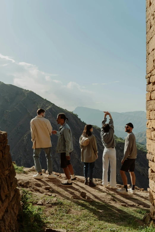 a group of people standing at the top of a mountain