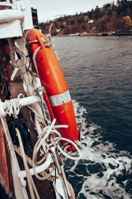 lifeguard buoy seen in foreground on the deck of ship