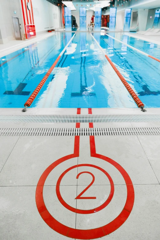 a pool with a big blue and red speed sign