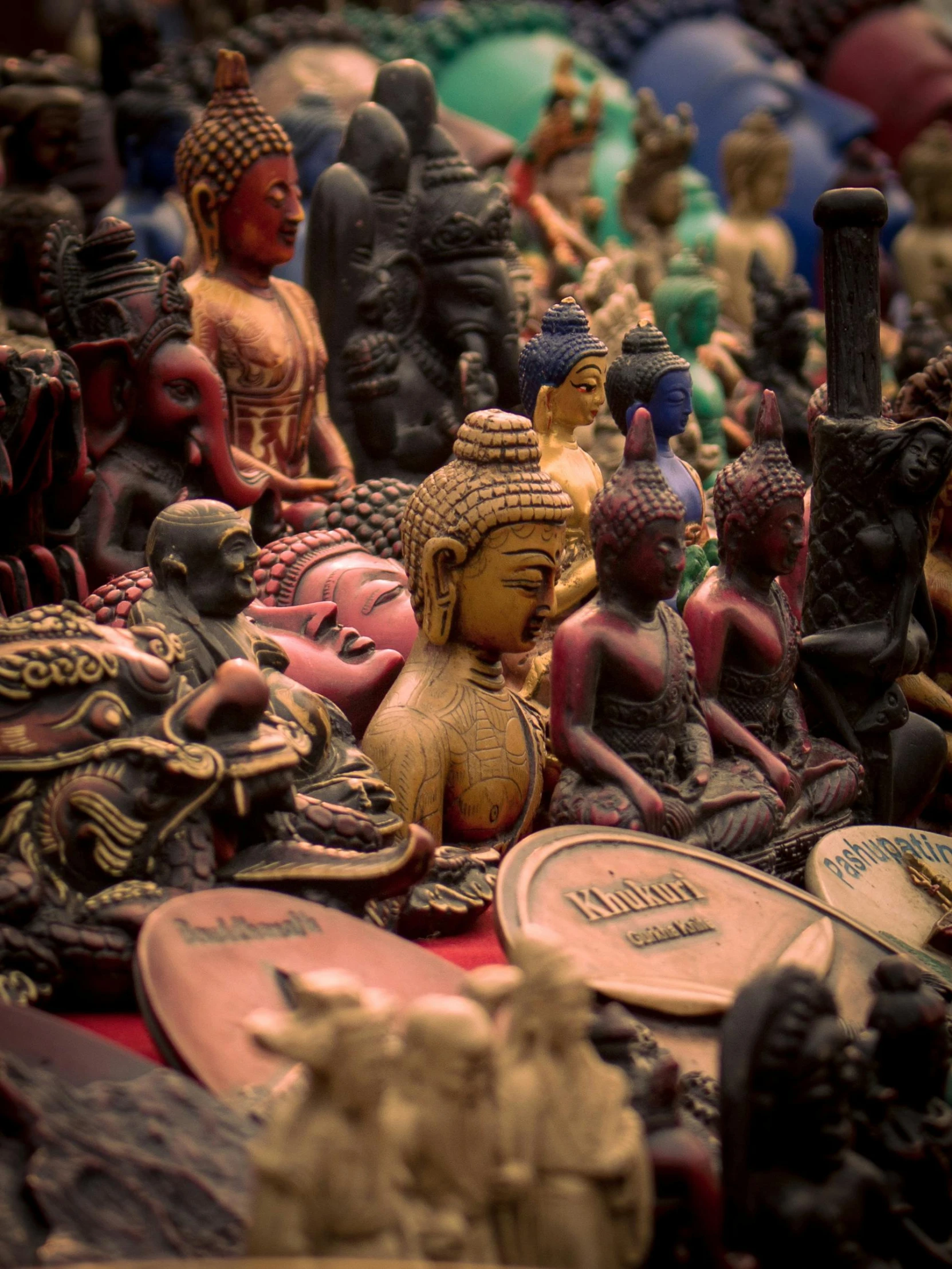 various carved wooden souvenirs displayed on tables