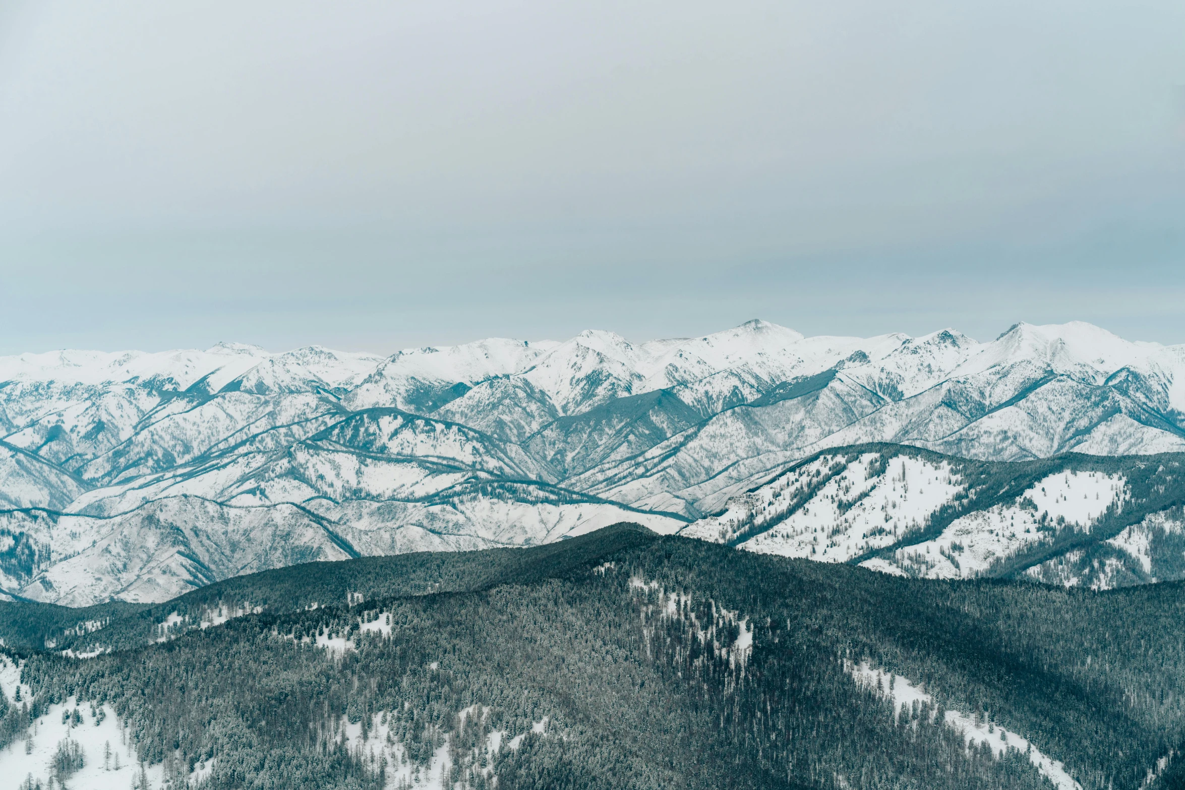 the snowy mountains are all covered in snow