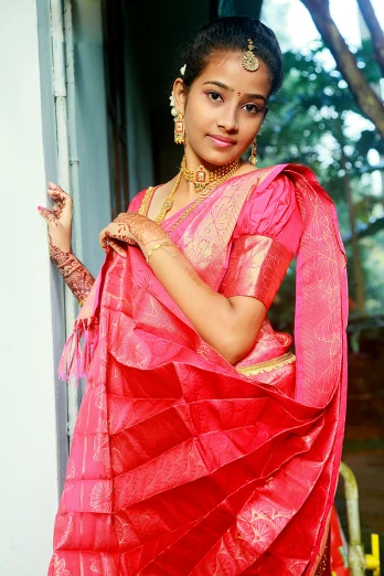 an indian woman in a red sari