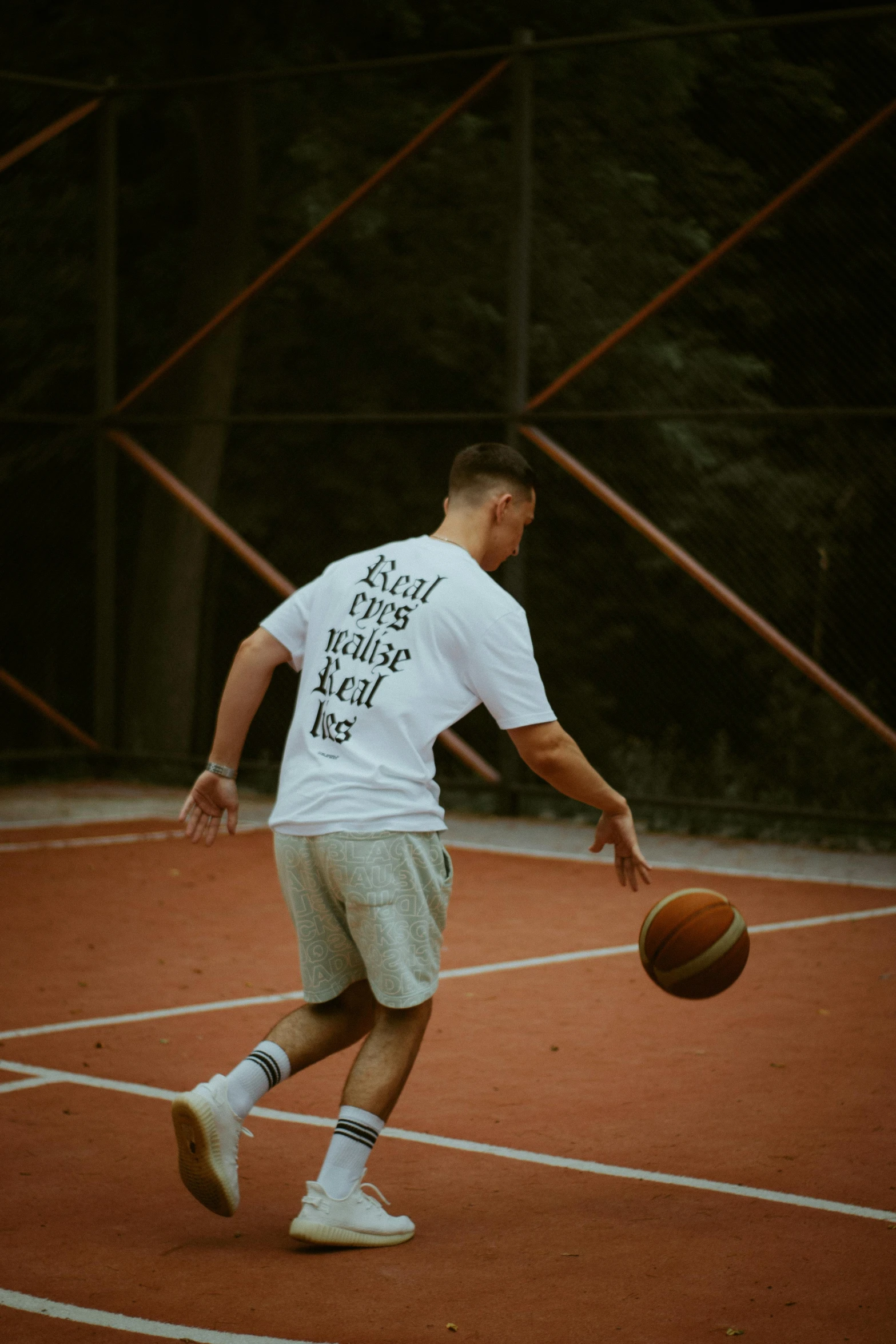 a basketball player dribbling a ball on a court