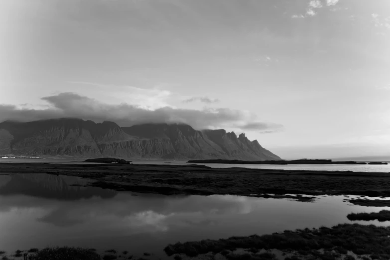 a black and white pograph of an island in the background