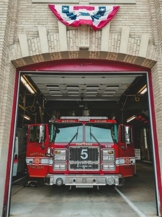 a large fire engine in a fire garage