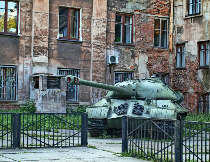 a close up of a tank near a fence