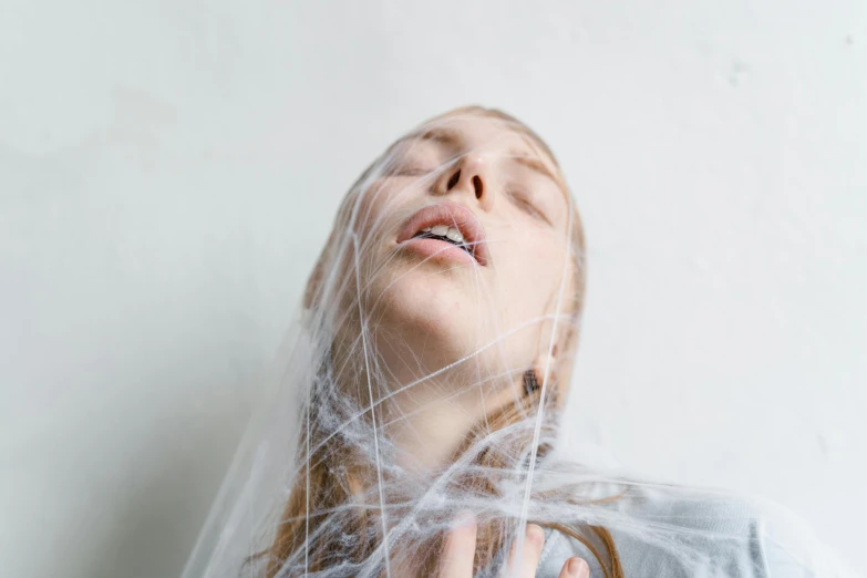 a young lady with freckles flying around her neck and her nose